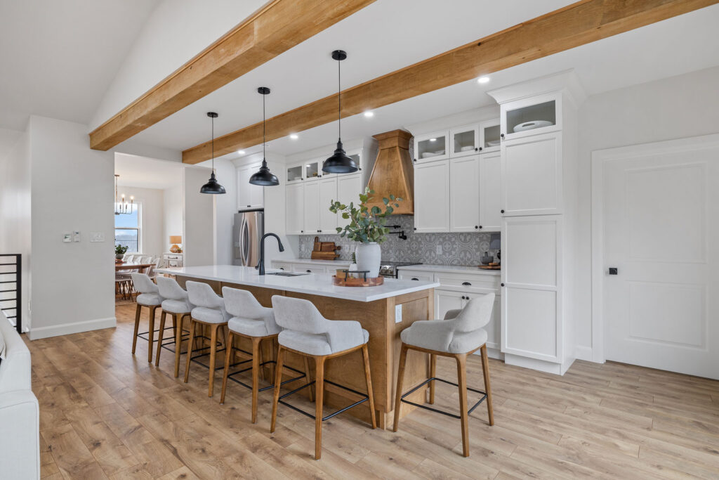 white kitchen with island and chairs